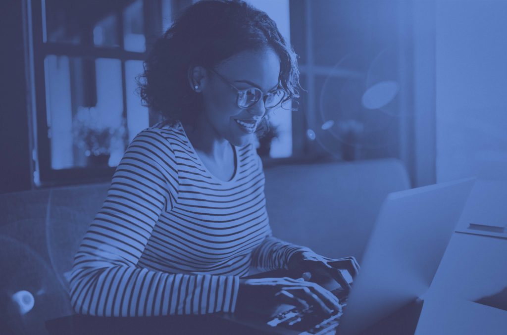 Woman typing on laptop