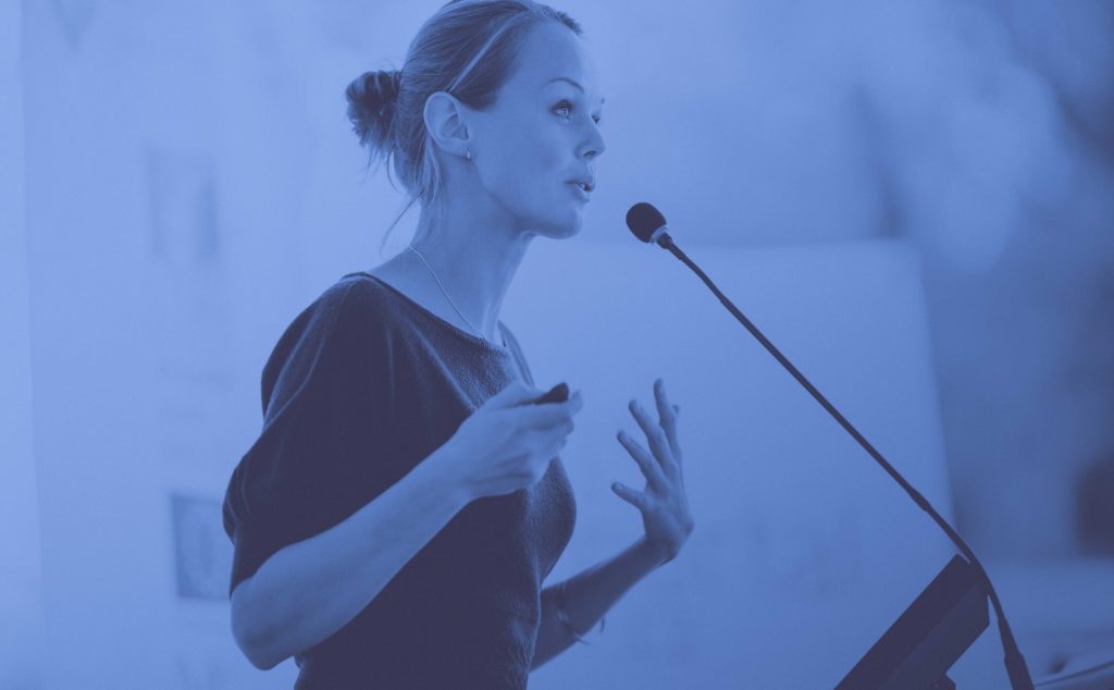 Woman speaking at podium