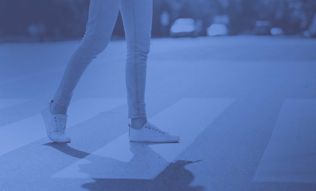 Girl walking in crosswalk