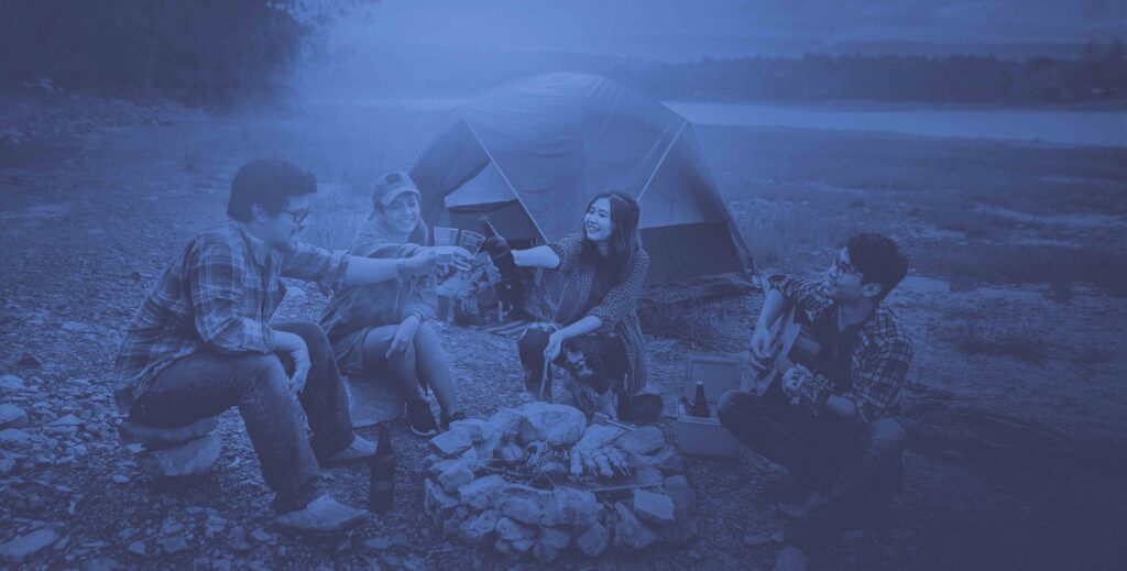 four people camping outside wilderness