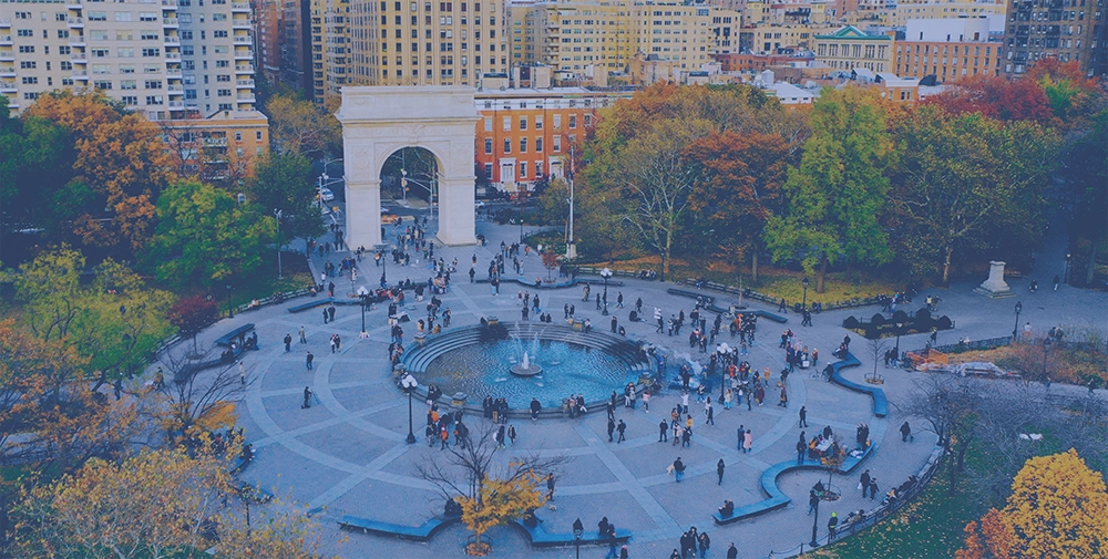 people milling around Washinton Square Park in NYC